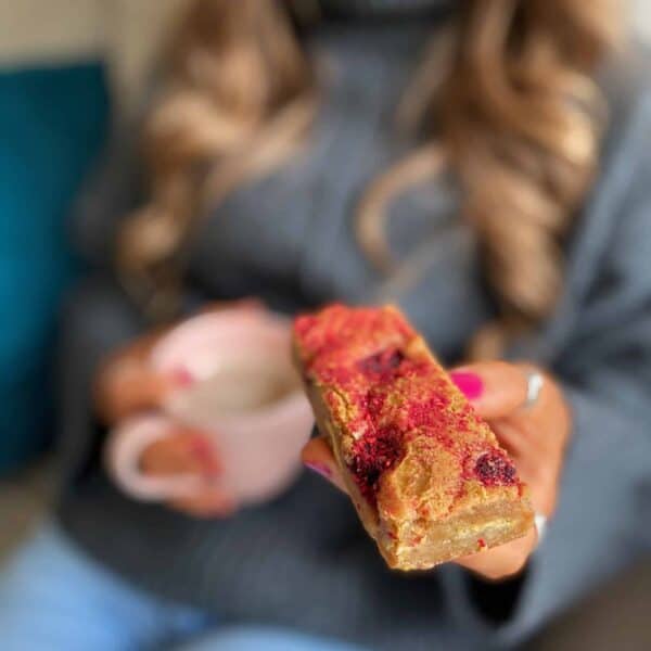 Image of a person holding our blondie brownies
