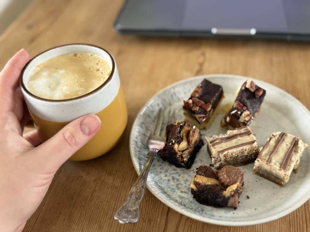 Image of our brownies plated with a coffee