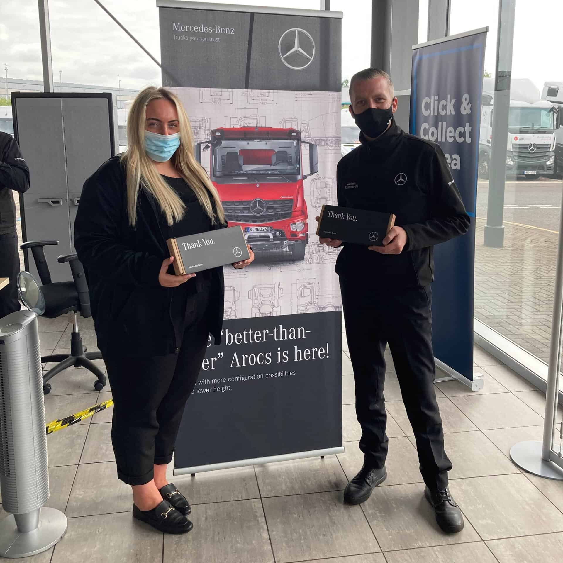 Image of Mercedes workers accepting our corporate gifts