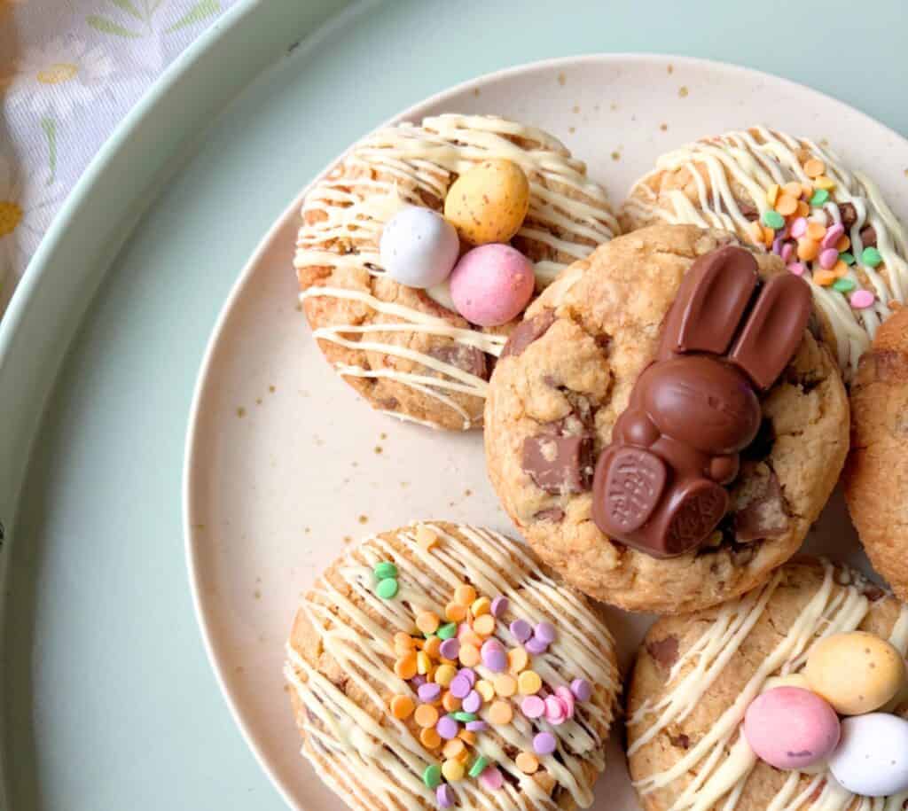 Delicious Easter bunny cookie topped with chocolate bunny and colourful sprinkles.