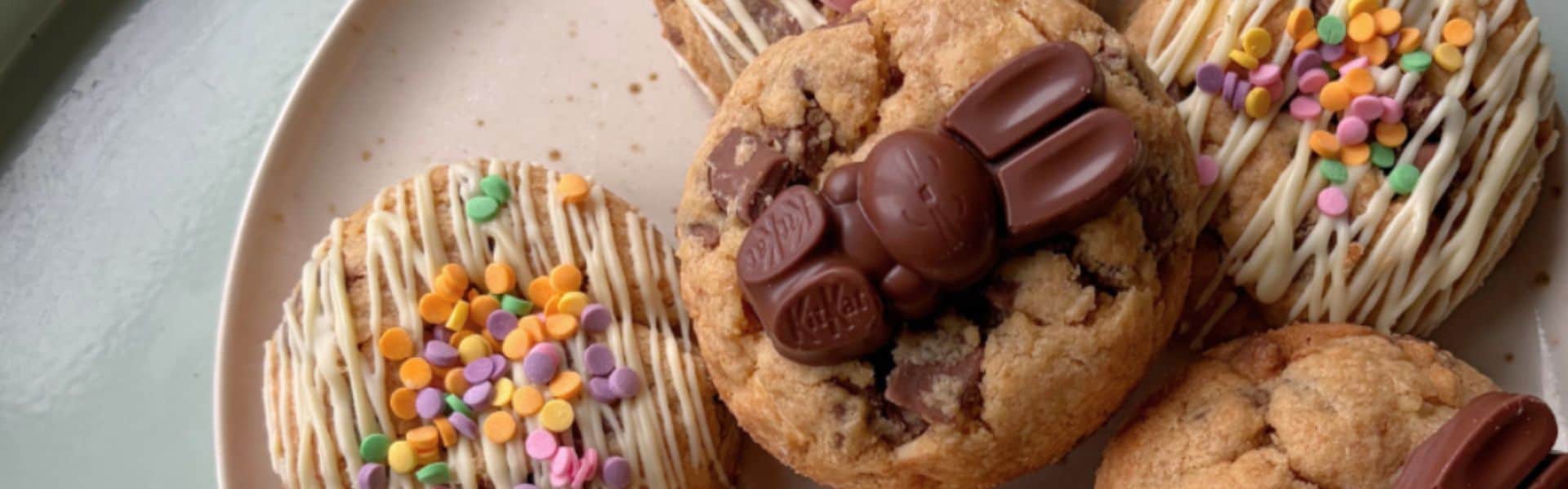 Assorted cookies topped with colourful sprinkles and chocolate candies, perfect for sweet cravings a.
