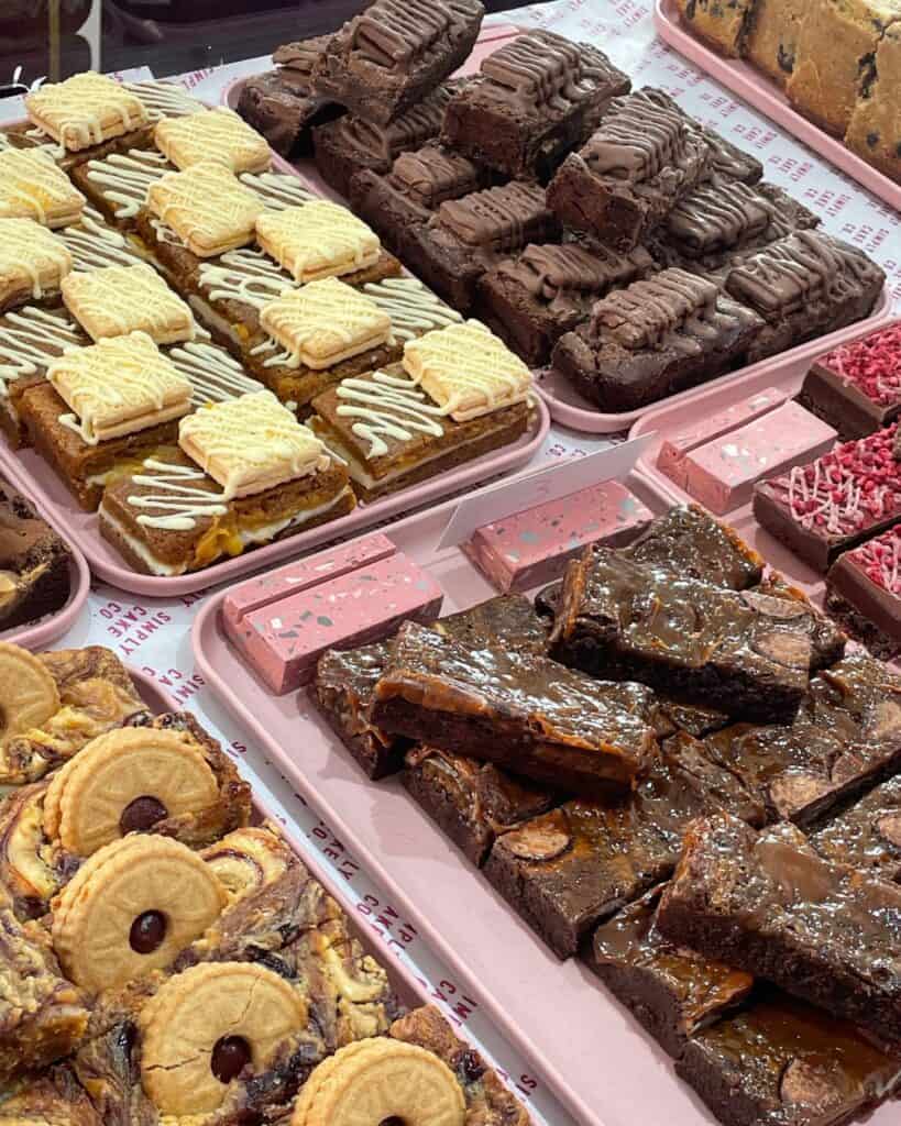 Delicious selection of chocolate brownies, biscuits, and caramel bars from Simply Cake Co bakery.
